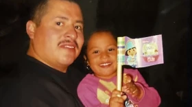 The author as a toddler and her father at their former home in Indiana.