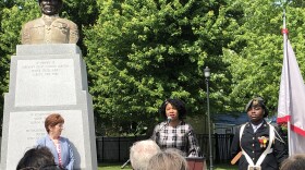 Albany Mayor Kathy Sheehan looks on as Tabetha Wilson address the gathering at Henry Johnson Park.