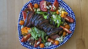 Chef Kathy Gunst's grilled steak salad with blue cheese, tomatoes, 
and greens. (Jesse Costa/WBUR)
