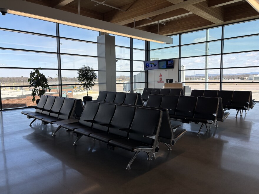 Rows of seating at an airport gate 