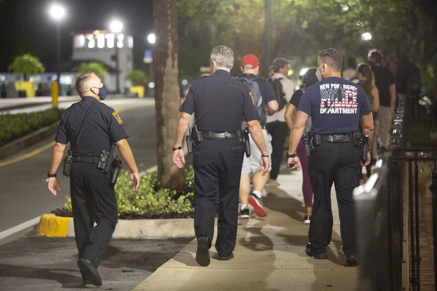 New Port Richey police walk behind protesters