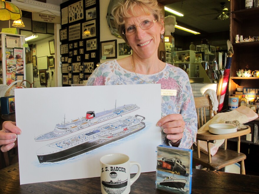 Sally Cole, co-owner of Cole's Antiques Villa in Ludington, Mich., displays some of the shop's memorabilia from the SS Badger.