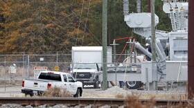 Workers work on equipment at the West End Substation, at 6910 NC Hwy 211 in West End, N.C., Monday, Dec. 5, 2022, where a serious attack on critical infrastructure has caused a power outage to many around Southern Pines, N.C. The North Carolina lawmaker who represents a county where gunfire at electrical substations cut power to thousands in December is pushing legislation to increase power grid security when the legislative session begins in earnest next week. (AP Photo/Karl B DeBlaker, File)