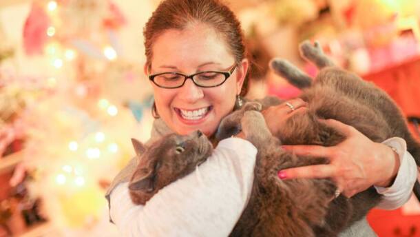 Marci Bowling, founder of Watching over Whiskers, holds a cat (submitted photo).