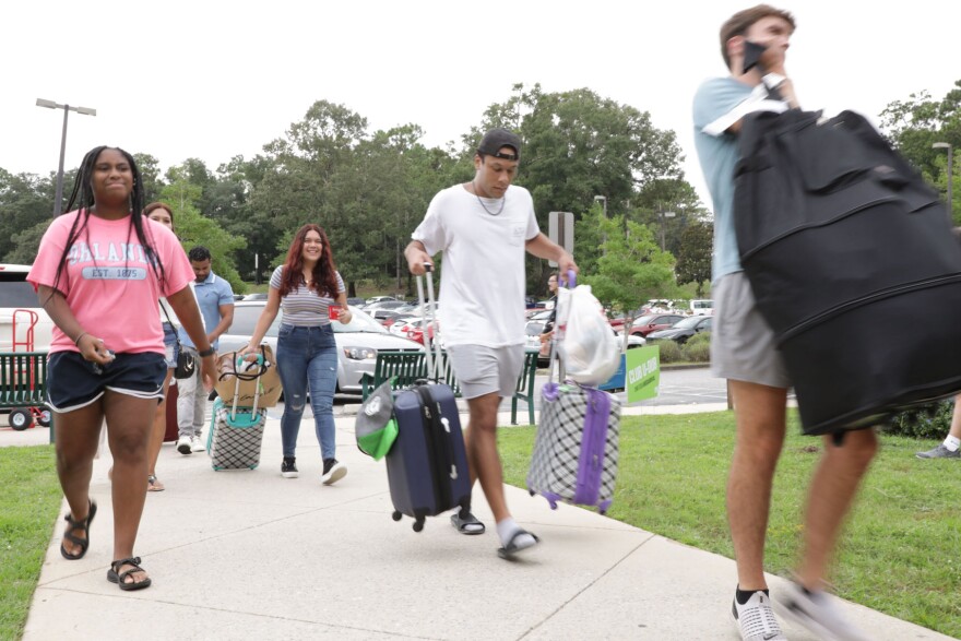 Students move in to Martin Hall on UWF campus, Friday, Aug. 19.