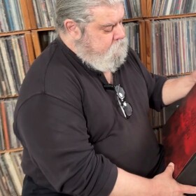 Walter Tunis opens a box set from the Eagles