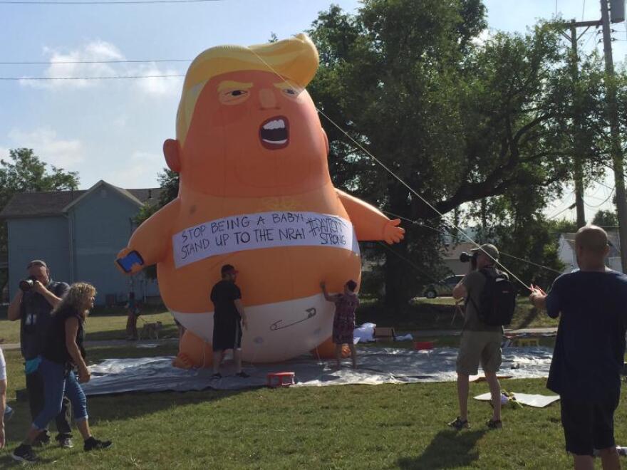 Trump's visit drew a crowd of protesters to the street outside the Miami Valley Hospital in the Dayton area. [Jess Mador / WYSO]