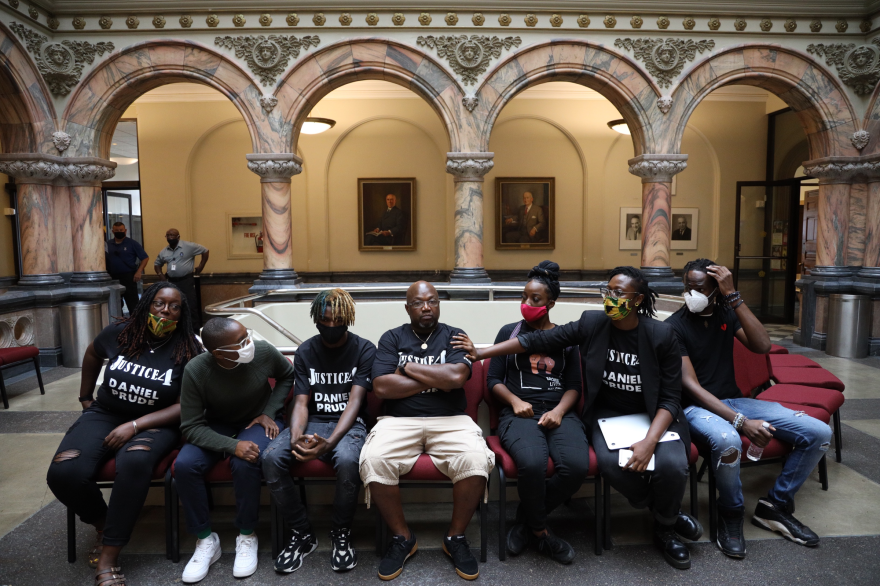 The family of Daniel Prude and supporters at City Hall on Wednesday, announcing plans to sue the city over Prude's death.