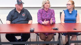 Eric Oakes, left, listens along Rachael Tully, assistant dean of students at VCU, right, as  Courtney White gives remarks following the inaugural Virginia Hazing Prevention Summit on Tuesday, June 4, 2024 at VCU in Richmond, Va.