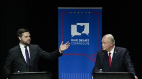 U.S. Senate Republican candidate J.D. Vance, left, makes a point as fellow candidate Mike Gibbons listens during Ohio's U.S. Senate Republican Primary debate, Monday, March 28, 2022, at Central State University in Wilberforce, Ohio.