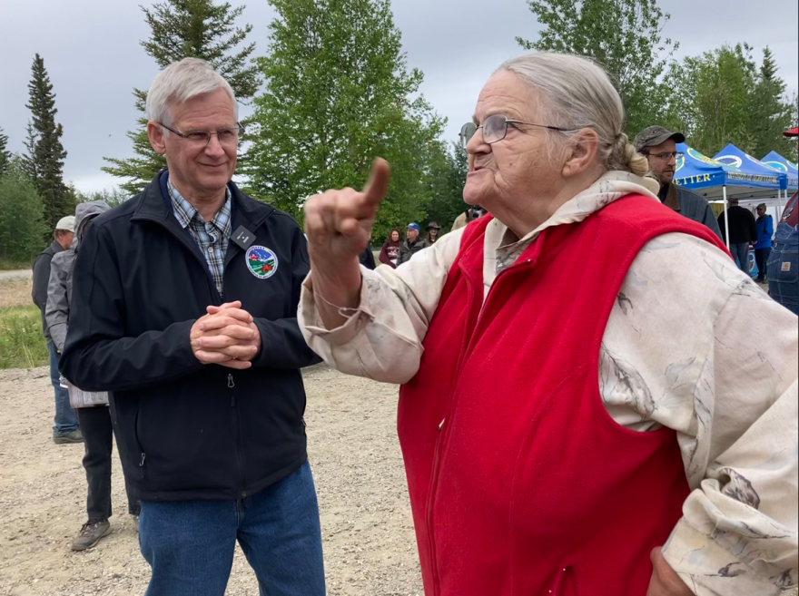 Kat McElroy emphatically states her concerns to state Agriculture Division Director Dave Schade, left, and other local and state officials during the June 10 Nenana Agricultural Education Day observance.