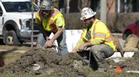 FILE - Construction workers work in Mount Prospect, Ill., Monday, Feb. 26, 2024. On Friday, April 5, 2024, the U.S. government issues its March jobs report. (AP Photo/Nam Y. Huh, File)