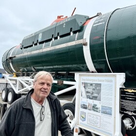 Larry Newland at Morro Bay Maritime Museum in front of US Navy (DSRV) Deep Submergence Rescue vessel