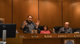 Assemblymember Scotty Smiley explains how best to cook rex sole at his last assembly meeting. (Photo by Kavitha George/KMXT)