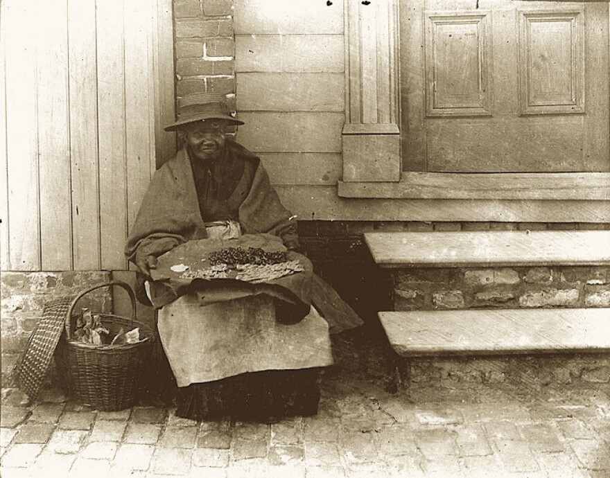 Chloe Jenkins (1843-1899), photographed in Charleston circa 1897, was a so-called "mauma," a free black woman who sold the city's signature groundnut cakes for a penny each.