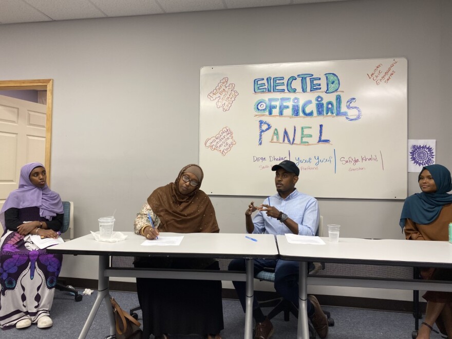 Yusuf Yusuf, an at-large member of the Portland school board, gestures while making a point during Friday night's discussion. Yusuf said volunteering for a local campaign can be a good way to get involved in politics for the first time.