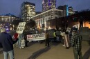 About 50 people gathered in uptown Charlotte Monday night to protest against the U.S. attack on Iran and its involvement in the Middle East.
