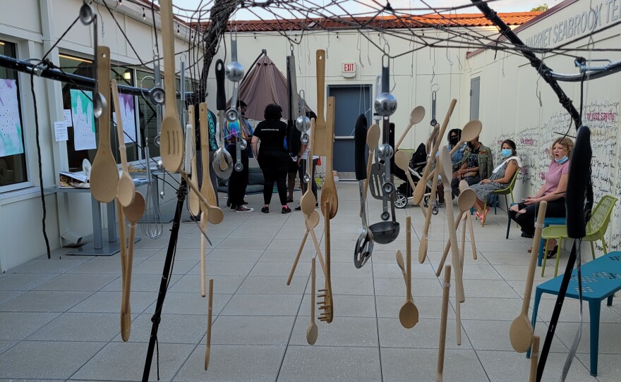 art installation of wooden spoons