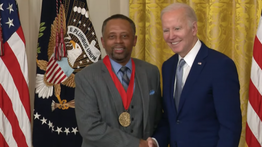 Dr. Earl Lewis (left) receives the National Medal for Humanities from President Joe Biden at Concordia University