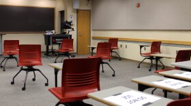 A classroom employing social distancing between student desks.
