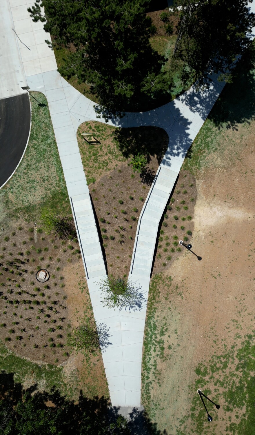 The bioswale and infiltration trails at the newly opened Maplewood Nature Center in Rochester. The stormwater features are designed to capture runoff from the parking lot, filter the water naturally through vegetation and soil, and reduce the amount of untreated runoff entering the adjacent pond.