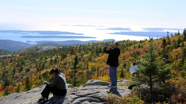 Visitors atop Cadillac Mountain in Acadia National Park on Saturday, Oct. 11, 2025.
