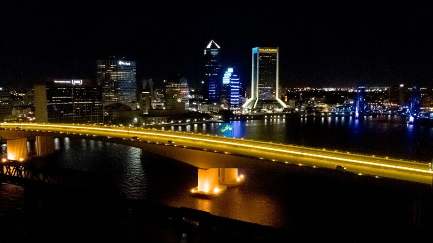 The Acosta Bridge glows yellow for Spina Bifida Awareness Month.