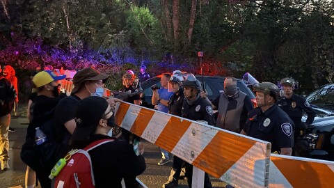 Protesters in front of a police barricade in Springfield on July 29, 2020.