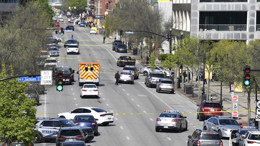 Louisville metro Police and emergency personnel block the streets outside of the Old National Bank building in Louisville, Ky., Monday, April 10, 2023.