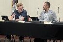 Alderpersons Brandon Moss (left) and Bobby Martin III chat before Monday's Washington City Council meeting. Each was part of a council discussion of a plan to hire a new city administrator.