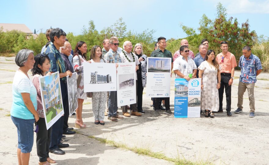 Honolulu Mayor Rick Blangiardi, center in white, announces funding for affordable housing alongside developers on Aug. 2, 2022.