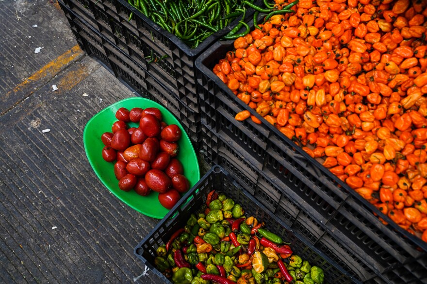 Each aisle of the Central de Abastos is dedicated to selling different kinds of produce, like this one featuring a huge variety of chile peppers and tomatoes.