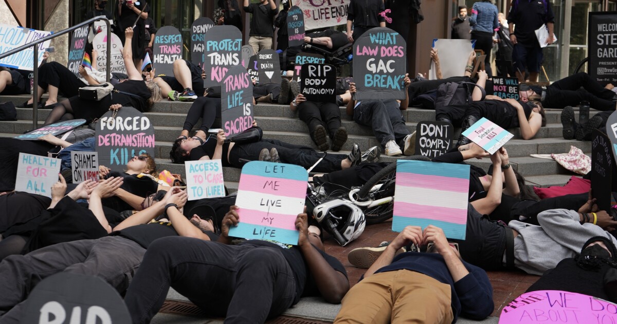 Protesters stage ‘die-in’ against UPMC service cuts for trans youth Protesters stage ‘die-in’ against UPMC service cuts for trans youth