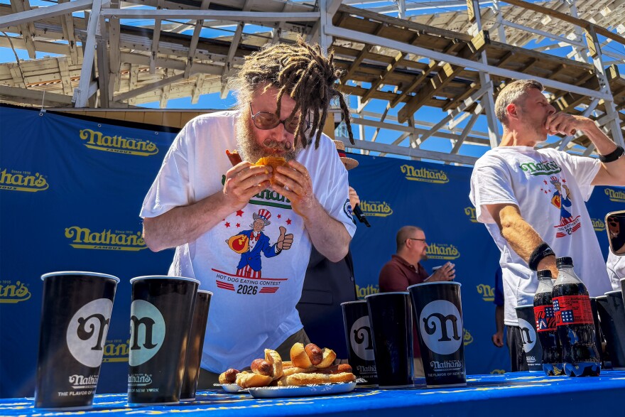 "Crazy Legs" Conti (left) competing at Lake Compounce during a Nathan’s Famous Hot Dog Eating Contest qualifier, where everyone is trying to prove they’re top dog June 13th 2026.