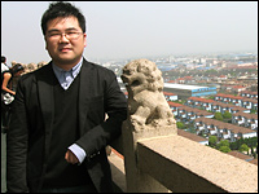 Huaxi resident Wu Hao, 26, runs an import-export business. Note the Dolce and Gabbana glasses. 