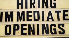 A hiring sign is posted outside business in Huntingdon Valley, Pa., on Feb. 22. Employers are keen for workers as the economy continues to recover from the pandemic.