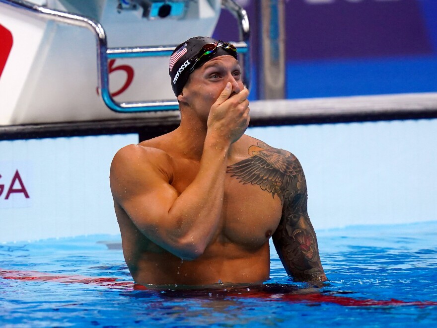 U.S. swimmer Caeleb Dressel celebrates after he wins the men's 100 meter freestyle final at the Tokyo Olympics on Thursday.