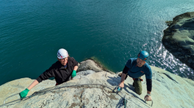 Kiara Hylton and Rahsaan Gregg make their way across one of three climbing routes at the Halutu Sky walk, a via ferrata tour set to launch next year in Haines.