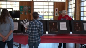 Eugene community members engage with art installations highlighting the stories of immigrants in Oregon on March 16, 2026.