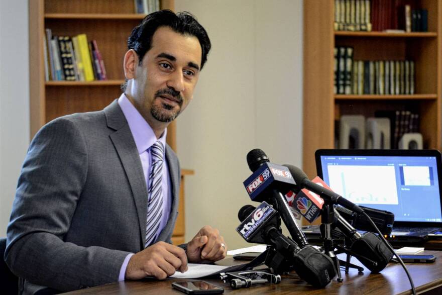 Hazem Bata, secretary general of the Islamic Society of North America, discussing vandalism to the building Monday.