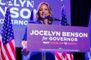 Jocelyn Benson speaking into a microphone podium.