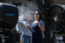 Christy Grady cools off in front of cooling fans during a University of Texas at Austin event in August of 2024 during a 107-degree day. 