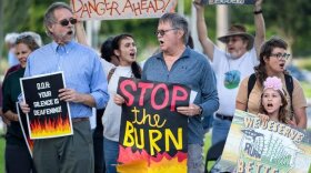 People protest outside the Palm Beach County Department of Health to demand action on health impacts from sugarcane field burning in the Glades. About 30 people participated in West Palm Beach, Florida on November 1, 2023.
