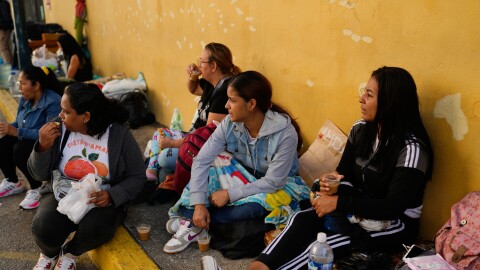 Relatives wait outside Zone 7 of the Bolivarian National Police, where political detainees are held, after spending the night there in Caracas, Venezuela, Monday, Jan. 12, 2026.