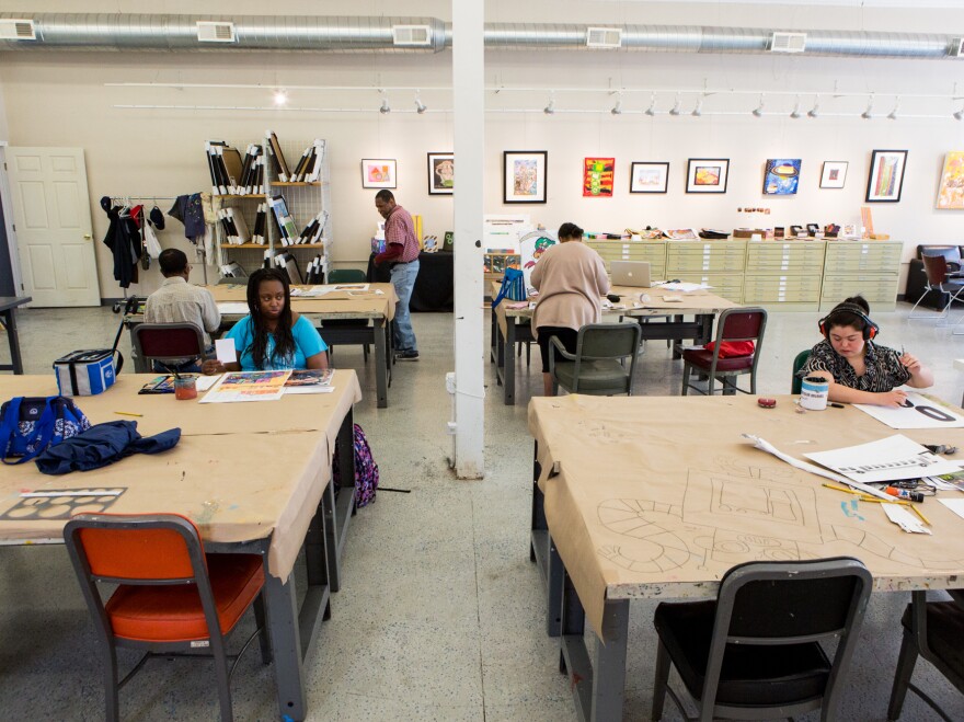 Artists work in the Art Enables studio and gallery in Northeast Washington, D.C., on a Monday afternoon in June.