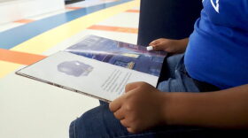 A fifth grader reads a book at Positive Tomorrows school in Oklahoma City on Aug. 17.