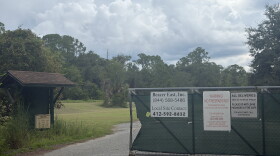 A gate blocks the entrance to the Koppers property in Gainesville, Florida, on Sept. 11, 2026. Signs at the entrance identify Beazer East Inc. and warn visitors that the property is a contaminated area.