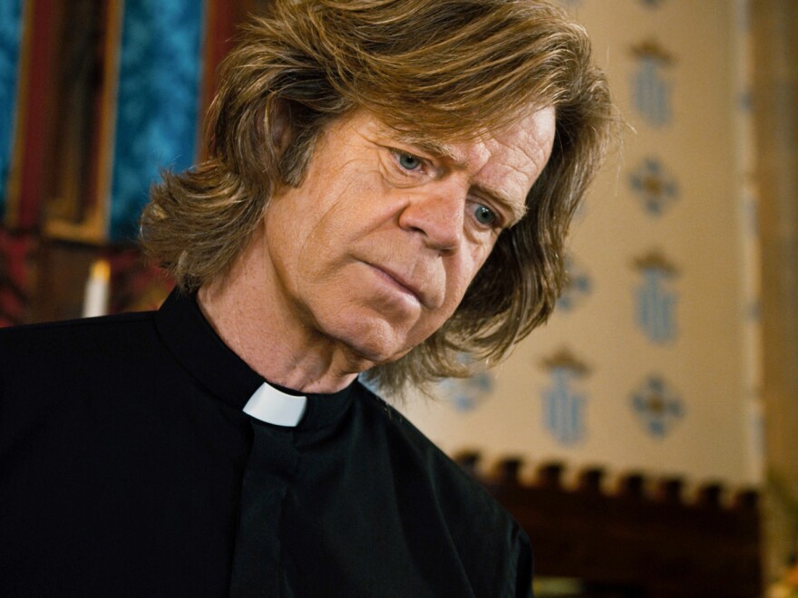 Father Brendan (William H. Macy) talks Mark through the ethical and religious questions posed by his arrangement.
