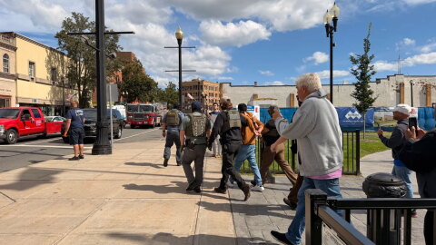 Members of an activist rapid response team film ICE agents outside a courthouse in Meriden on Wednesday, Sept. 23, 2026.