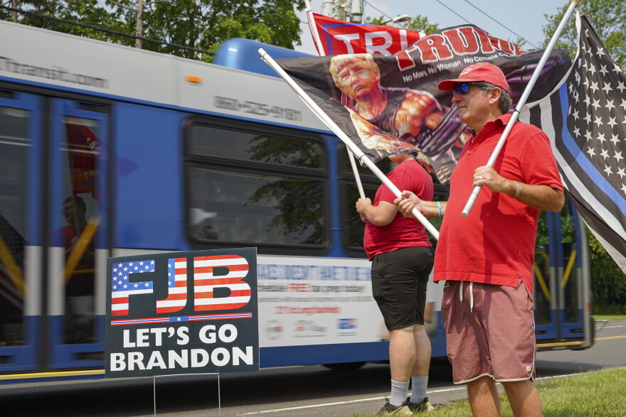 Protestors gather outside the National Safer Communities Summit at University of Hartford, June 16, 2023.